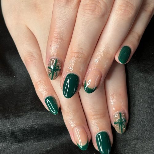 Durable BIAB nails featuring deep green polish from The Gel Bottle, styled at Sirens Beauty Salon in Durham.