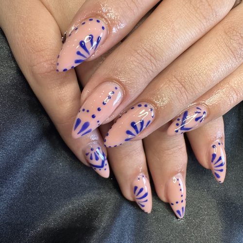 Long nails created with BIAB and finished with elegant nail art at Sirens Beauty Salon in Durham.
