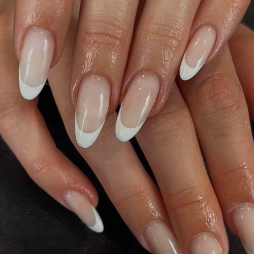 Long BIAB nails with a timeless French manicure finish, created at Sirens Beauty Salon in Durham.