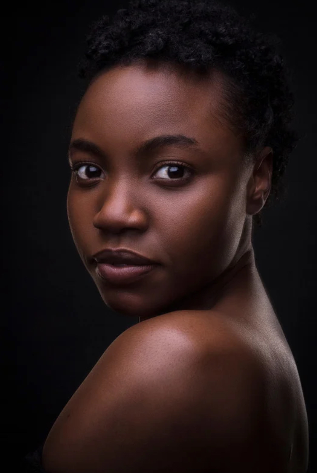 Woman with smooth, clear skin representing rejuvenating facials at Sirens Beauty Salon in Durham.